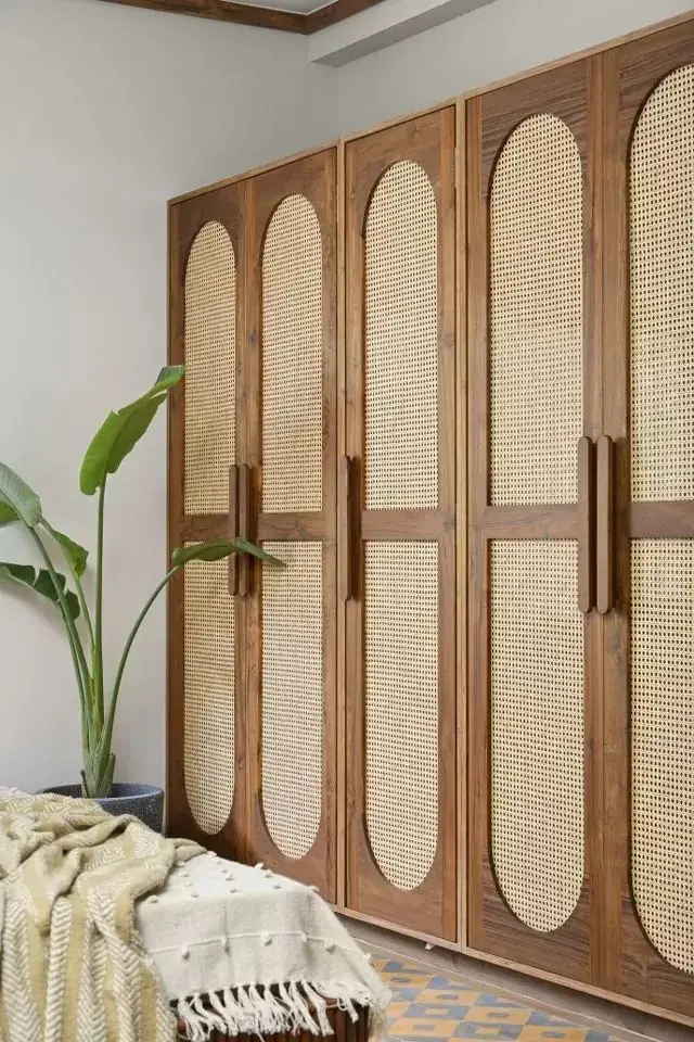 Wardrobe with cane-panel shutters and wooden frames